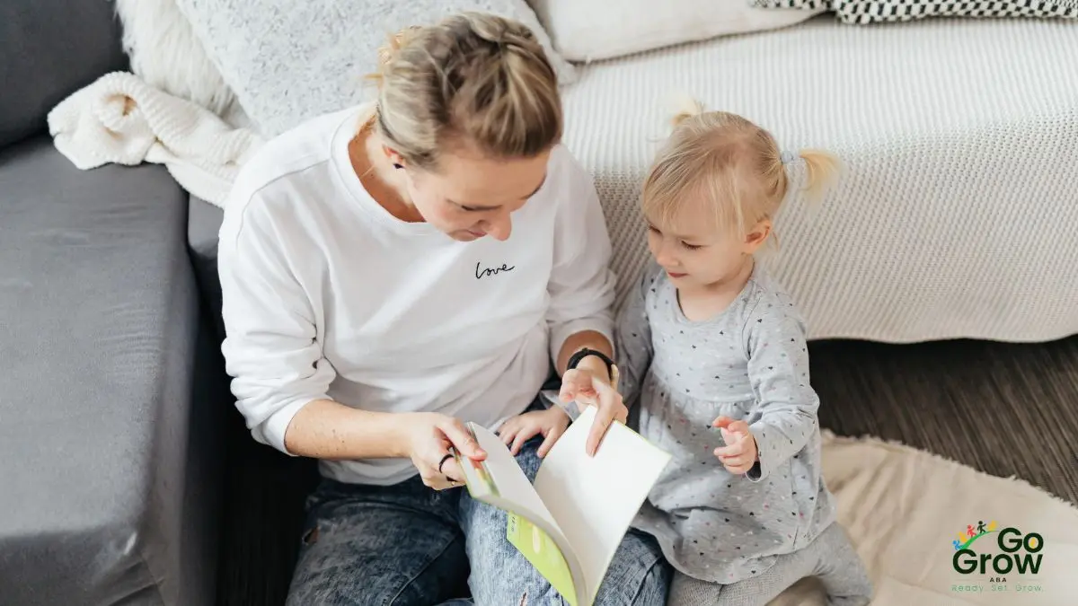 mother-and-young-child-sharing-storytime-on-bedroom-floor