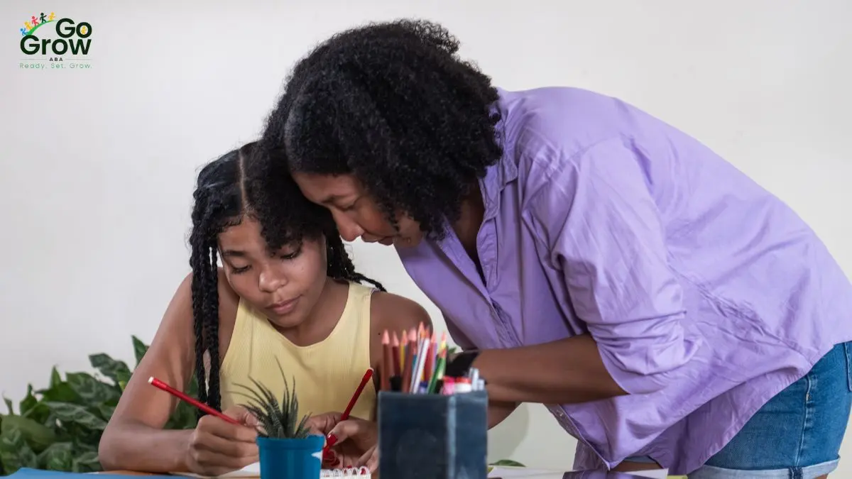 parent-supporting-young-girl-during-art-and-learning-activity