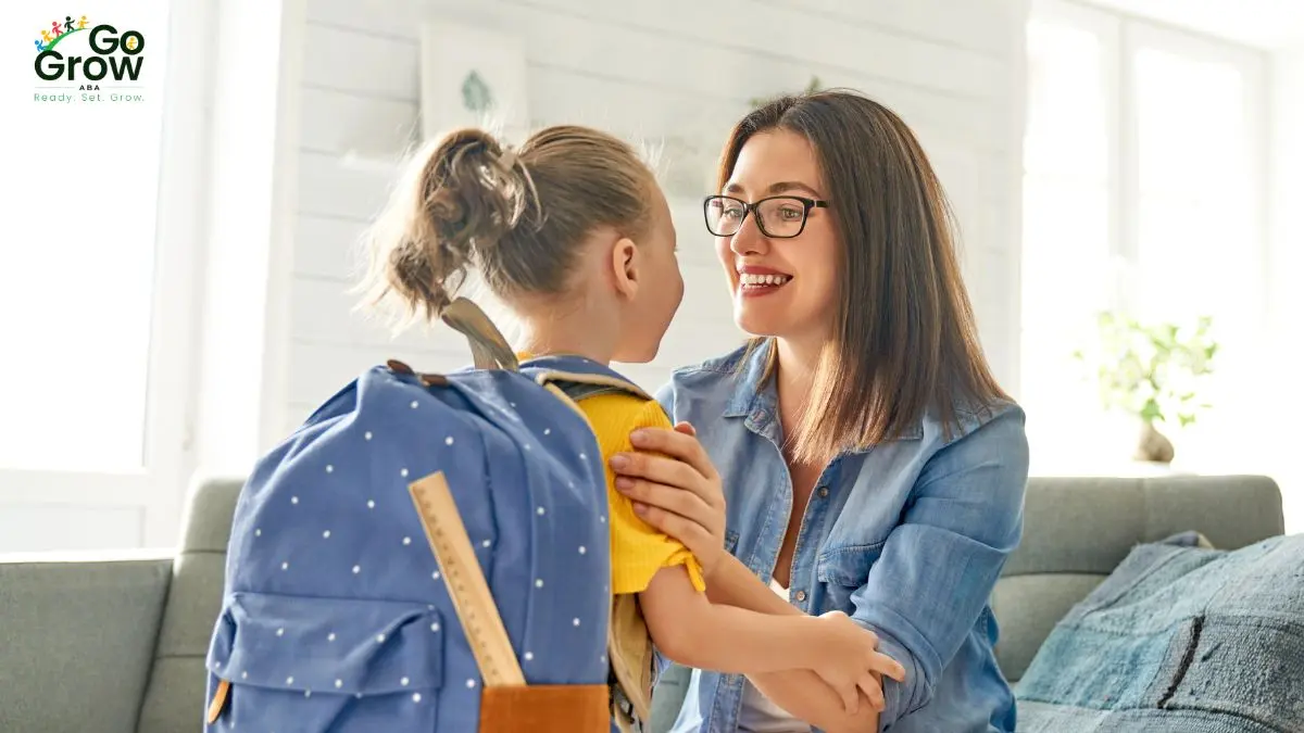 parent-talking-with-school-age-child-wearing-backpack-before-school
