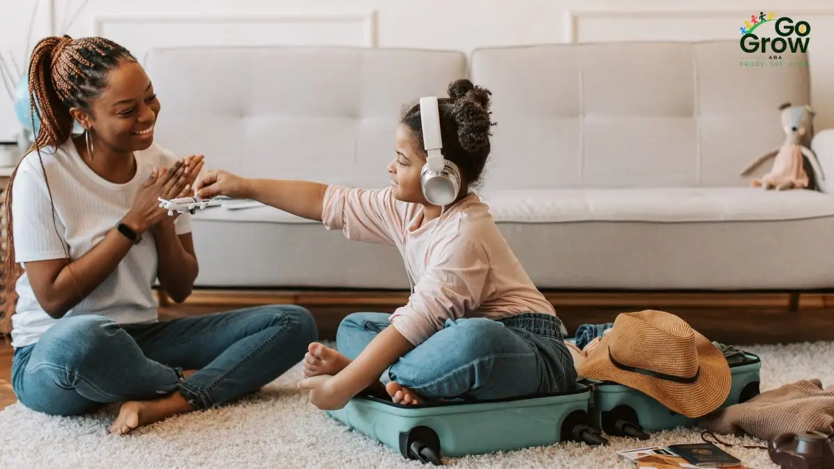 caregiver-and-child-playing-travel-game-at-home