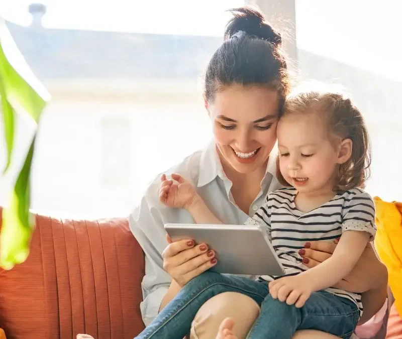 parent-and-child-using-tablet-together-at-home