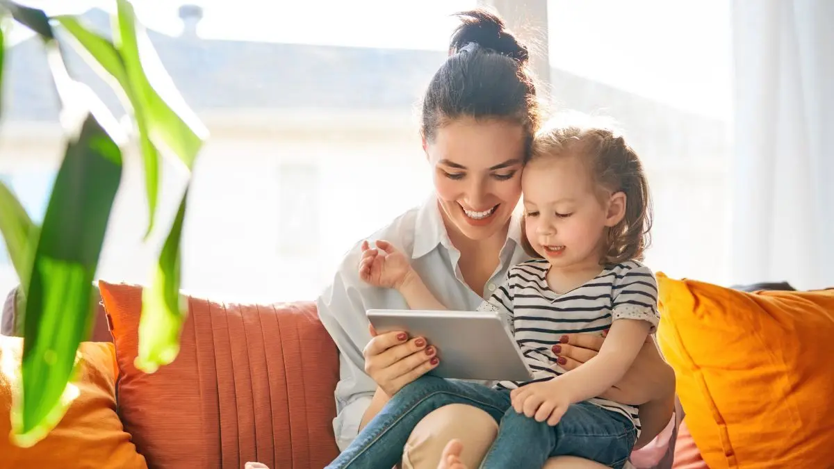 parent-and-child-using-tablet-together-at-home