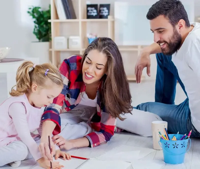 parents-helping-child-with-learning-activity-at-home