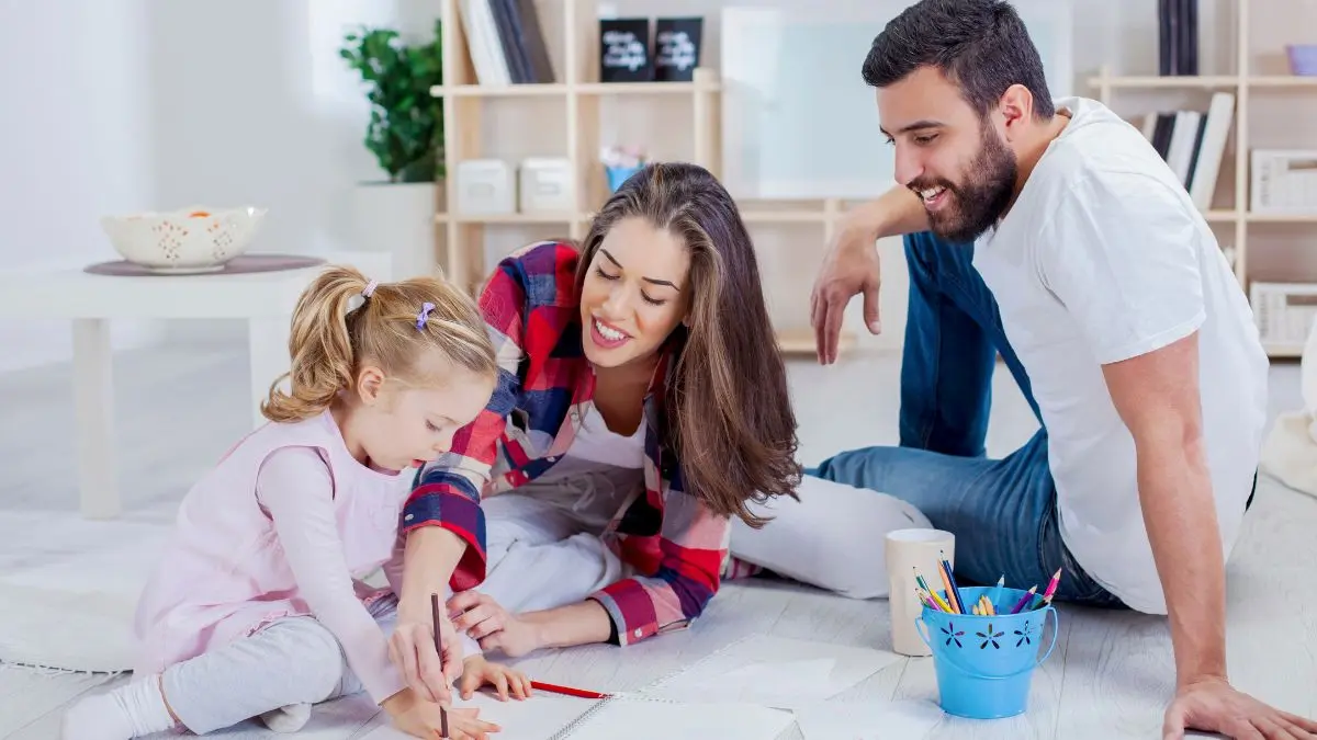 parents-helping-child-with-learning-activity-at-home