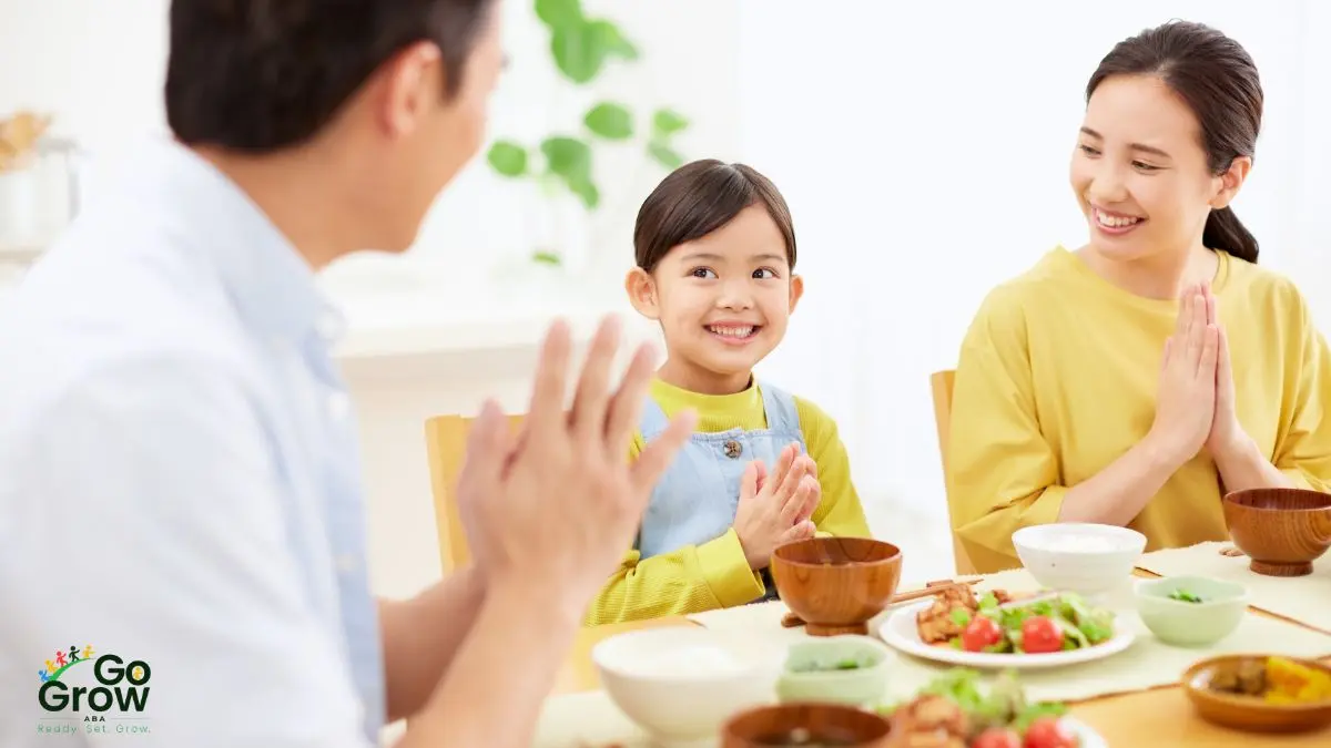 child-and-parents-smiling-before-eating-together