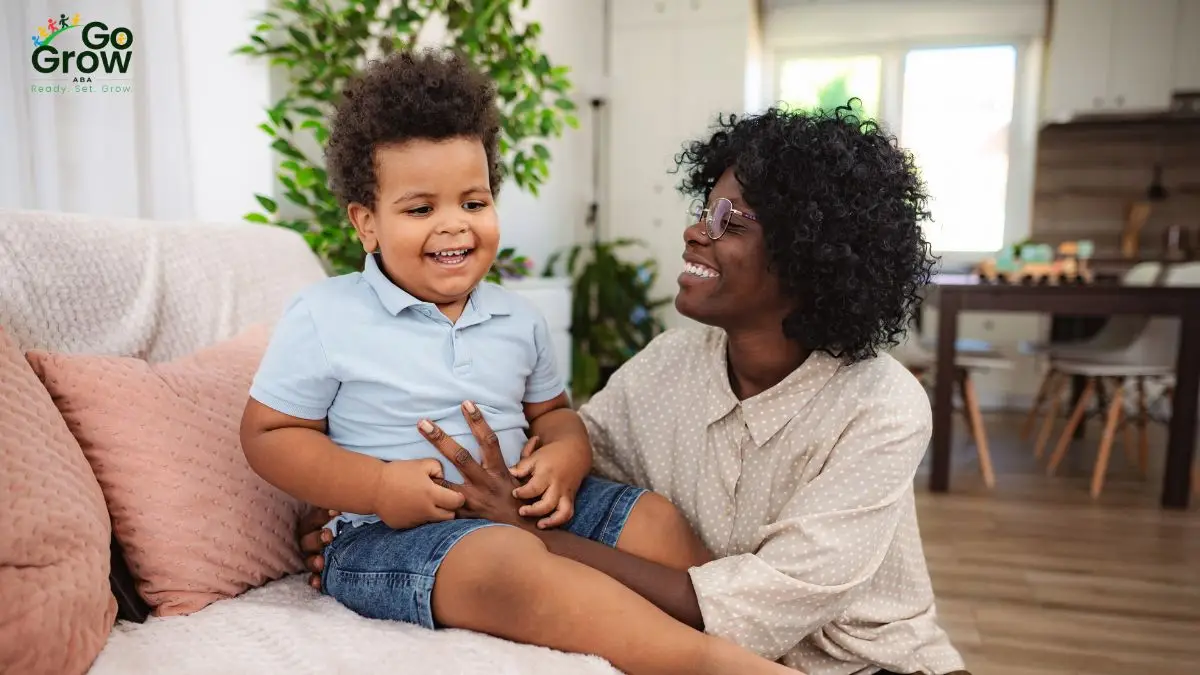 child-laughing-with-woman-in-bright-living-room
