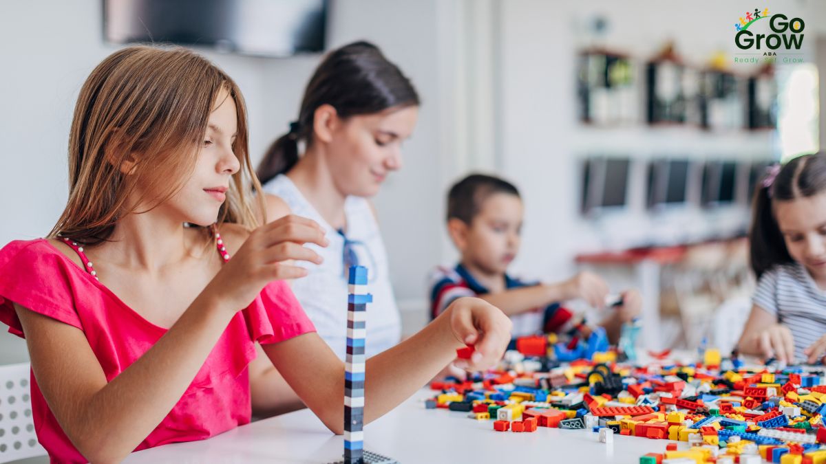 children-playing-with-colorful-building-blocks-at-table
