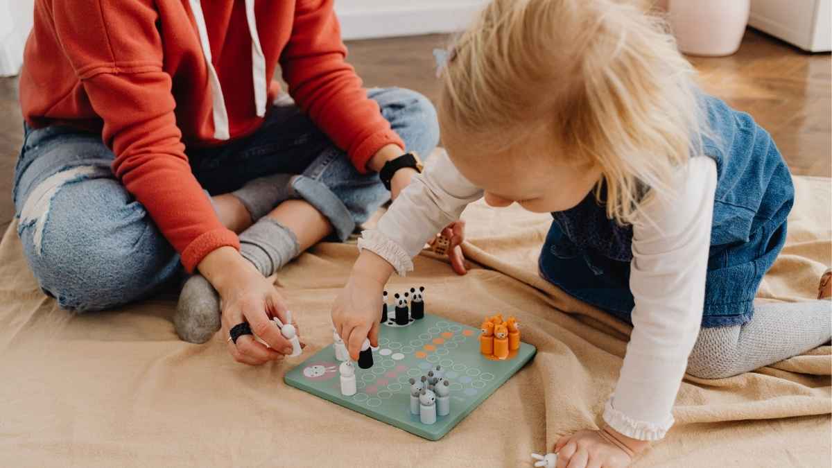 Therapist and child playing a board game during an in-home ABA therapy session in NJ